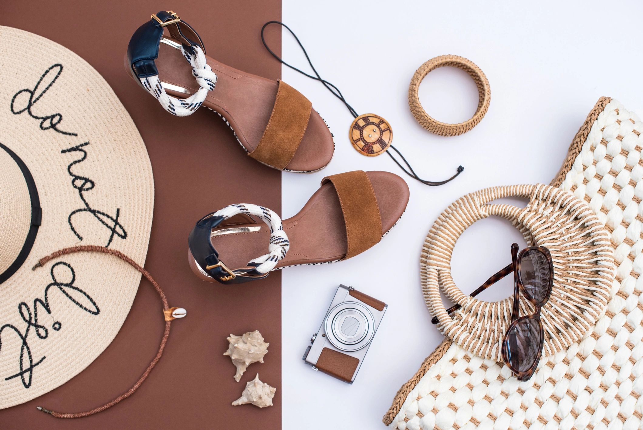 Apparel accessories arranged in neutral tones for a fashion shopping call to action