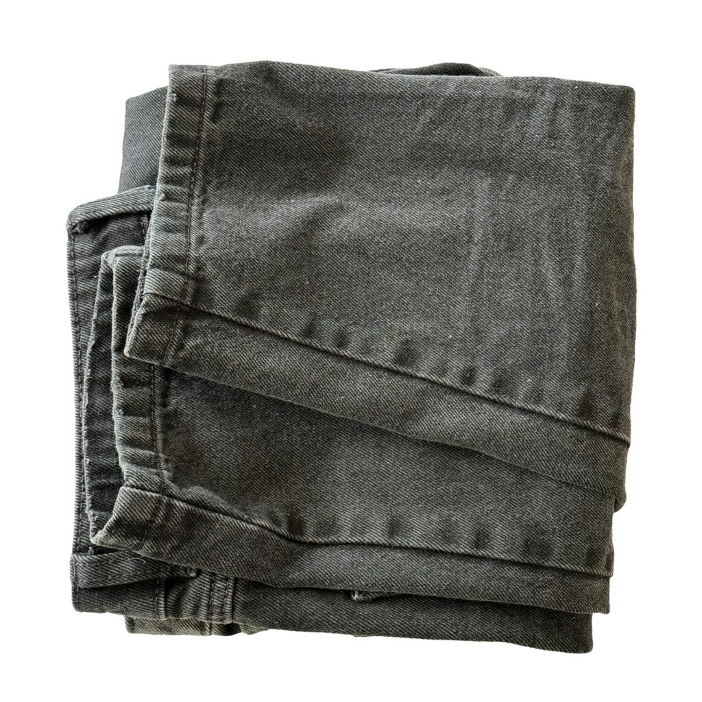Folded jeans isolated on white background